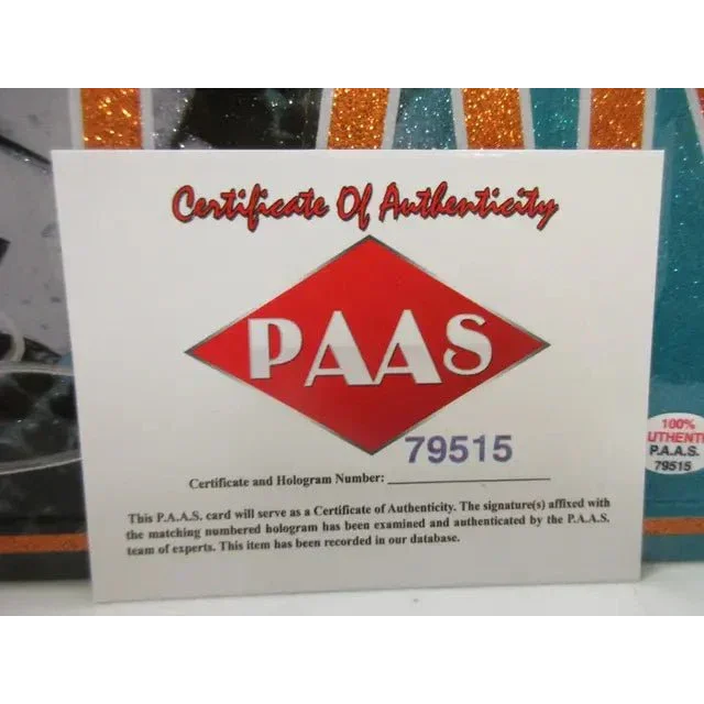 White certificate of authenticity with red diamond logo for Miami Dolphins signed autographed metal collectible