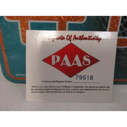 White certificate of authenticity with red PAAS logo for Miami Dolphins signed autographed metal collectible