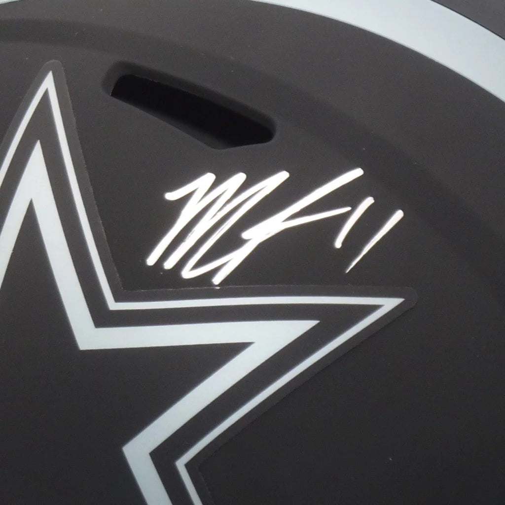 Black hockey helmet with white lightning bolt logo autographed by micah parsons autographed dallas cowboys replica helmet