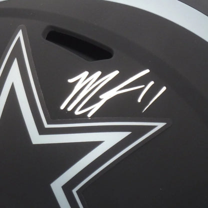Black hockey helmet with white lightning bolt logo autographed by micah parsons autographed dallas cowboys replica helmet