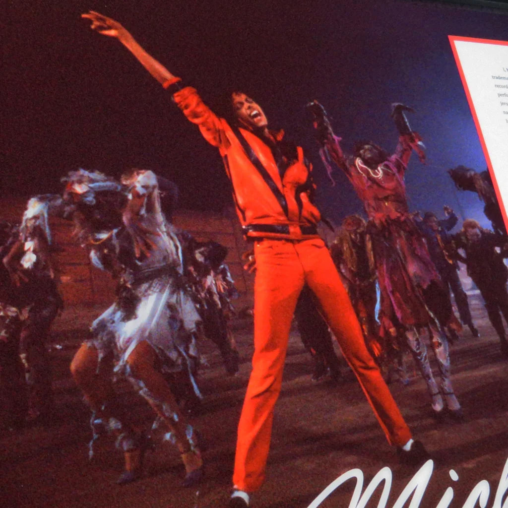 Michael Jackson autographed contract framed display with orange jumpsuit image