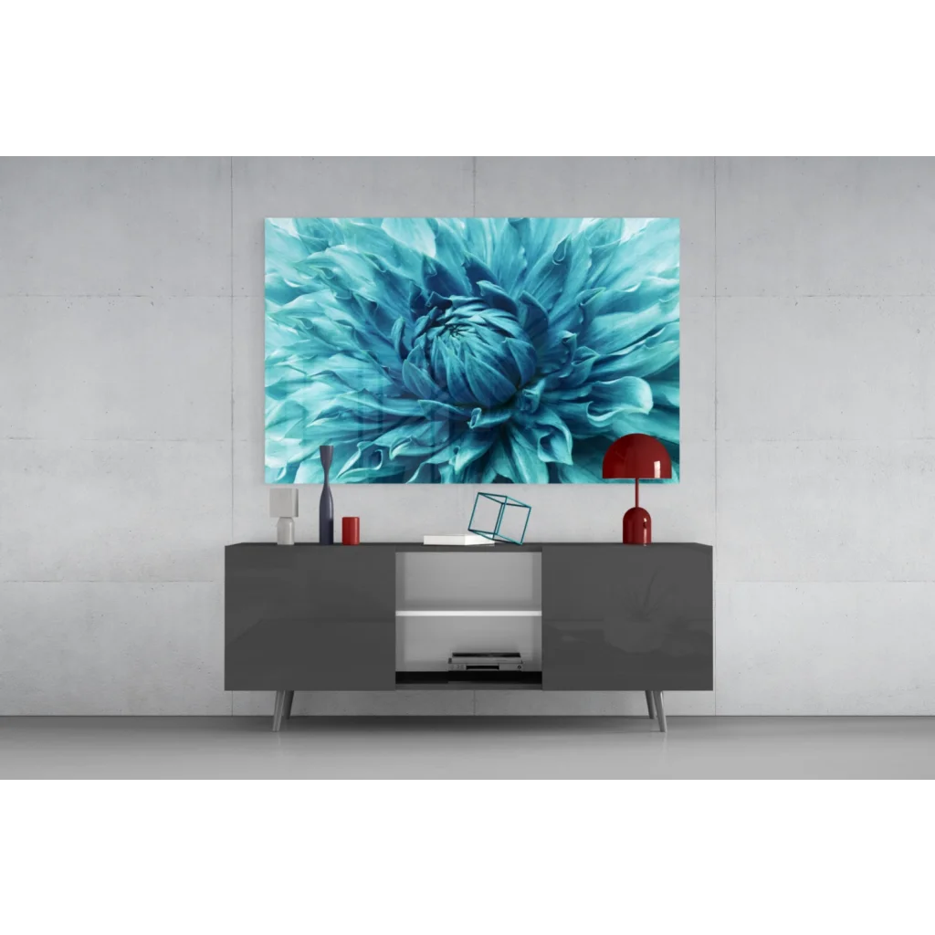 Vibrant teal dahlia glass wall art above gray console table