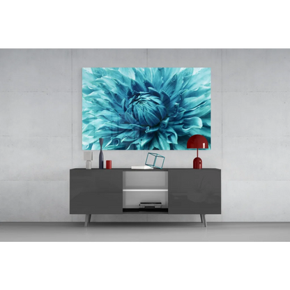 Vibrant teal dahlia glass wall art above gray console table