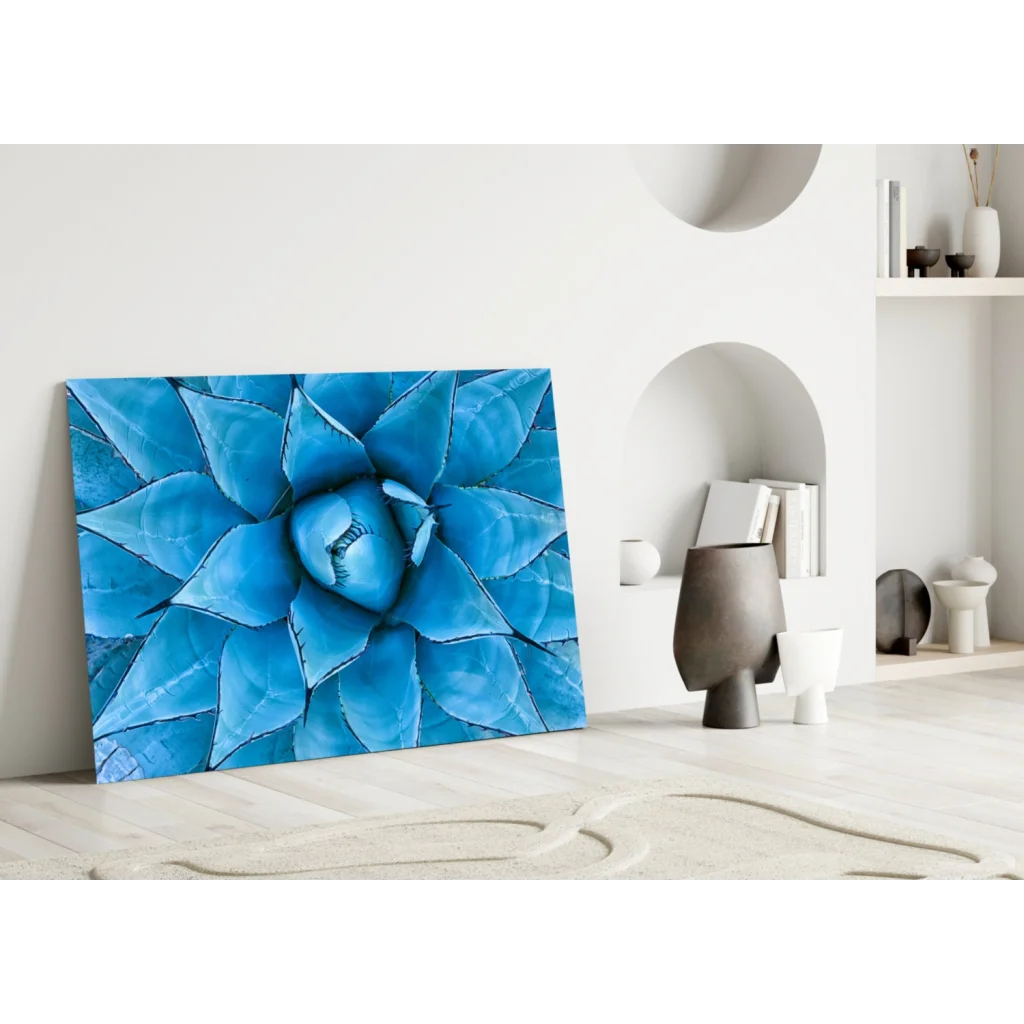 Vibrant blue glass wall art of close-up agave plant leaves