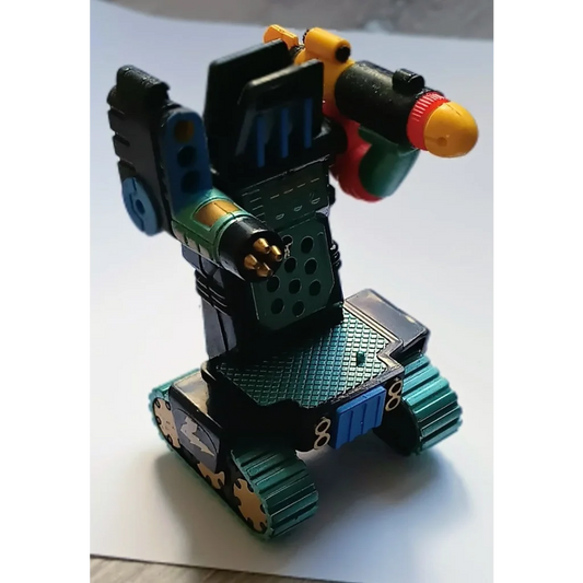 Green black Micro Machines Z Bots tank robot toy with yellow accents