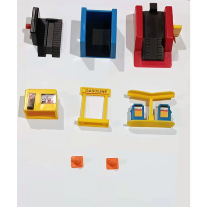 Vintage 1987 Micro Machines City Service Center action playset with red and yellow toy gas station, pumps, fuel containers, and sign