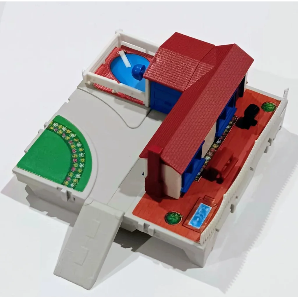 3D-printed micro machines travel city suburban house with red roof and blue walls