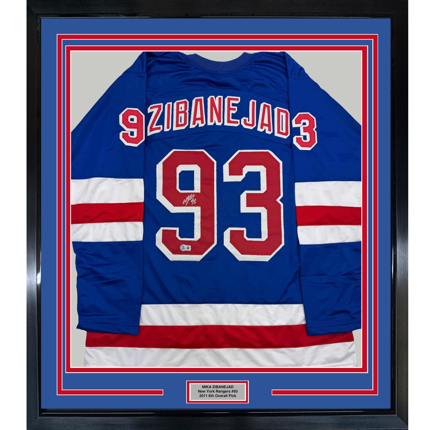 Blue New York Rangers hockey jersey #93 with "ZIBANEJAD" across chest, signed, displayed in framed presentation with red and white border.