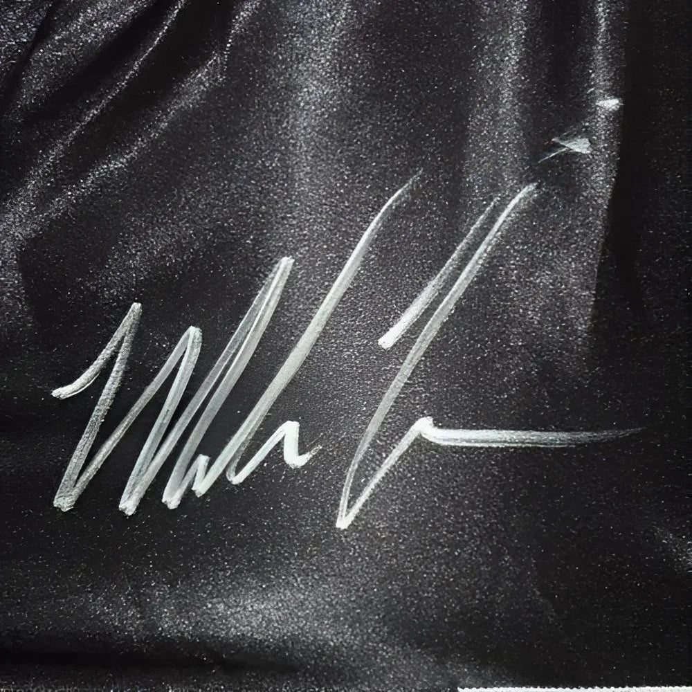 Mike Tyson autographed black boxing trunks with hologram