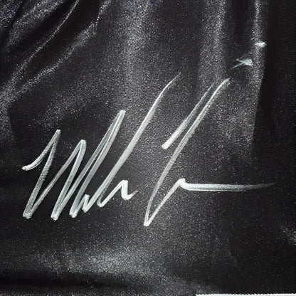 Mike Tyson autographed black boxing trunks with hologram