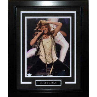 Miley Cyrus autographed 11x14 photo in black frame with white mat and silver plaque