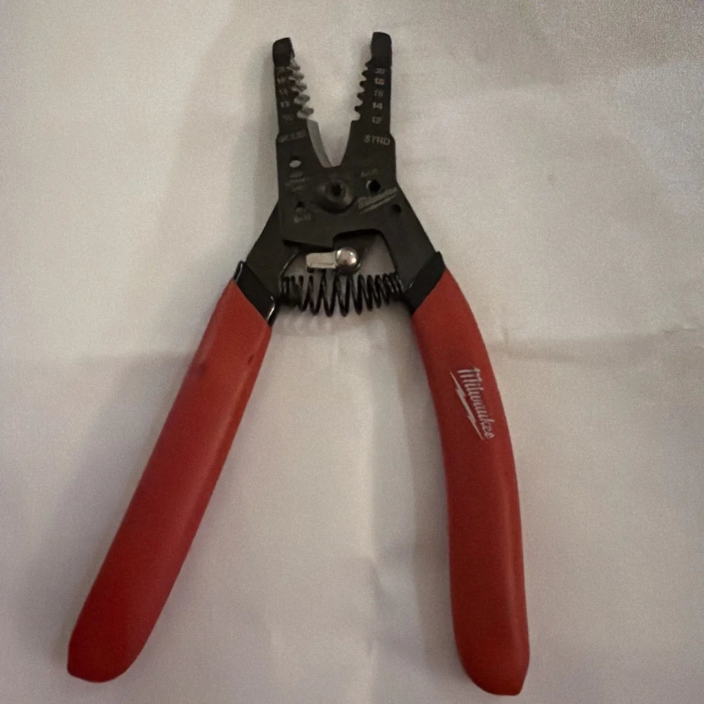 Milwaukee automatic wire stripper 10-20 AWG red handles black jaws spring