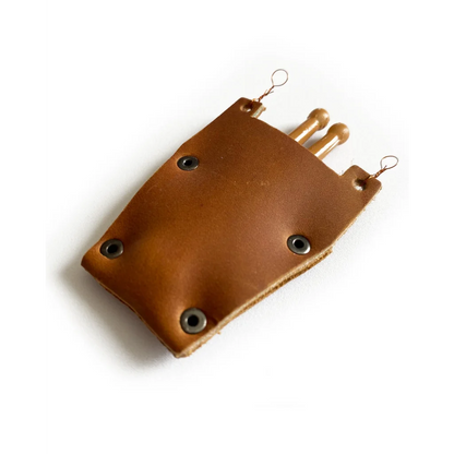 Mini leather drumstick bag with brown leather pouch and metal grommets