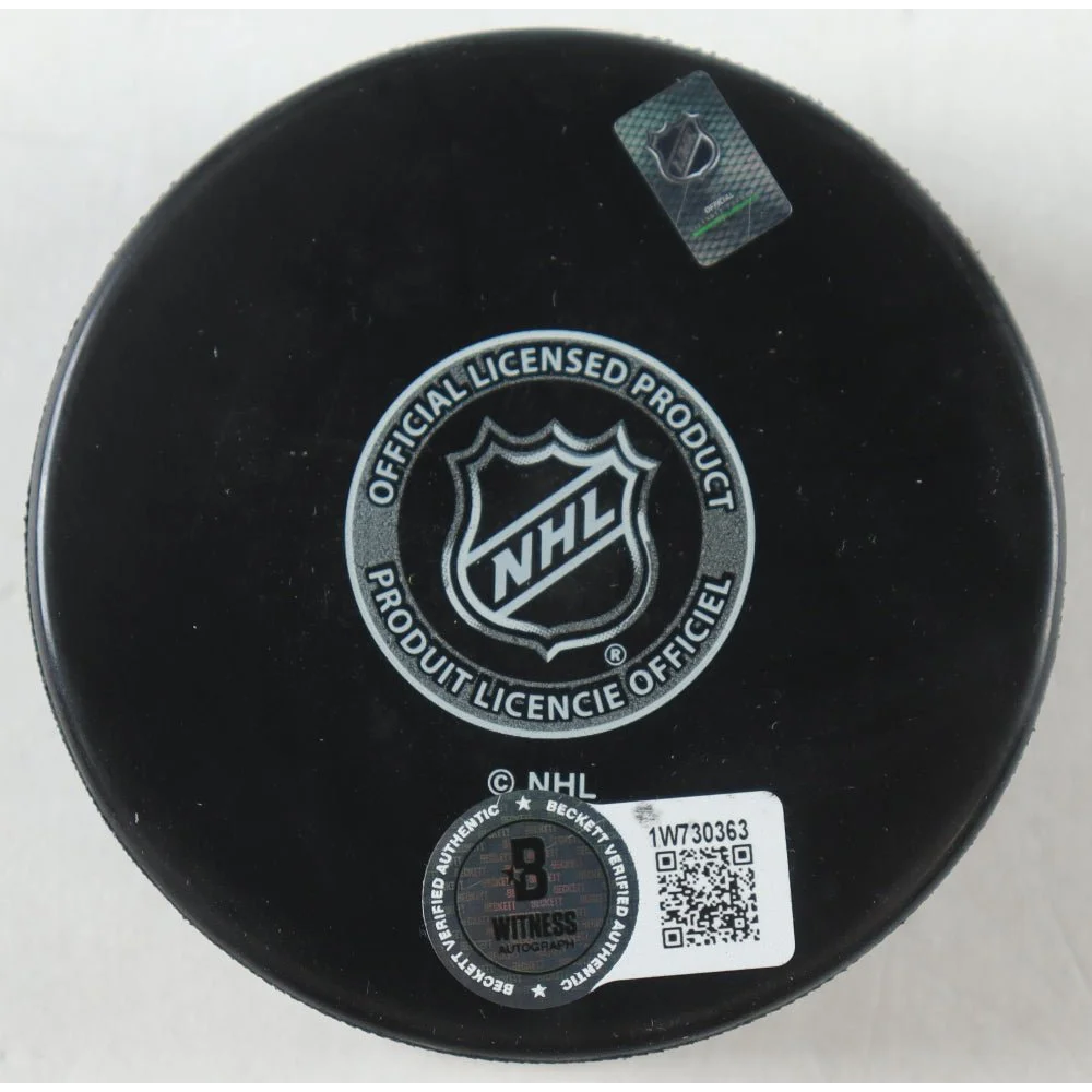 Black Dallas Stars logo hockey puck with NHL license and Beckett authentication