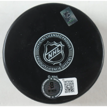 Black Dallas Stars logo hockey puck with NHL license and Beckett authentication