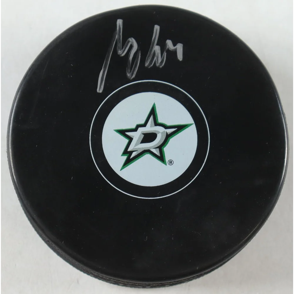 Black Dallas Stars logo hockey puck with white and green Stars logo for collectible fans