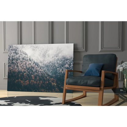 Dark blue rocking chair with wooden frame and Misty Mountain Forest glass wall art