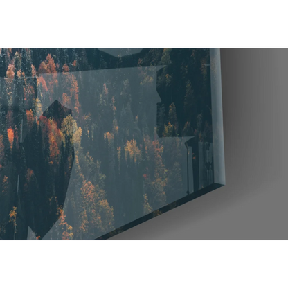 Sleek TV showing Misty Mountain Forest glass wall art with vivid autumn trees