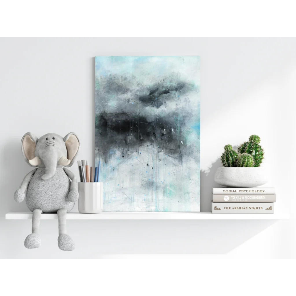 Gray plush elephant toy with floppy ears on modern abstract print shelf