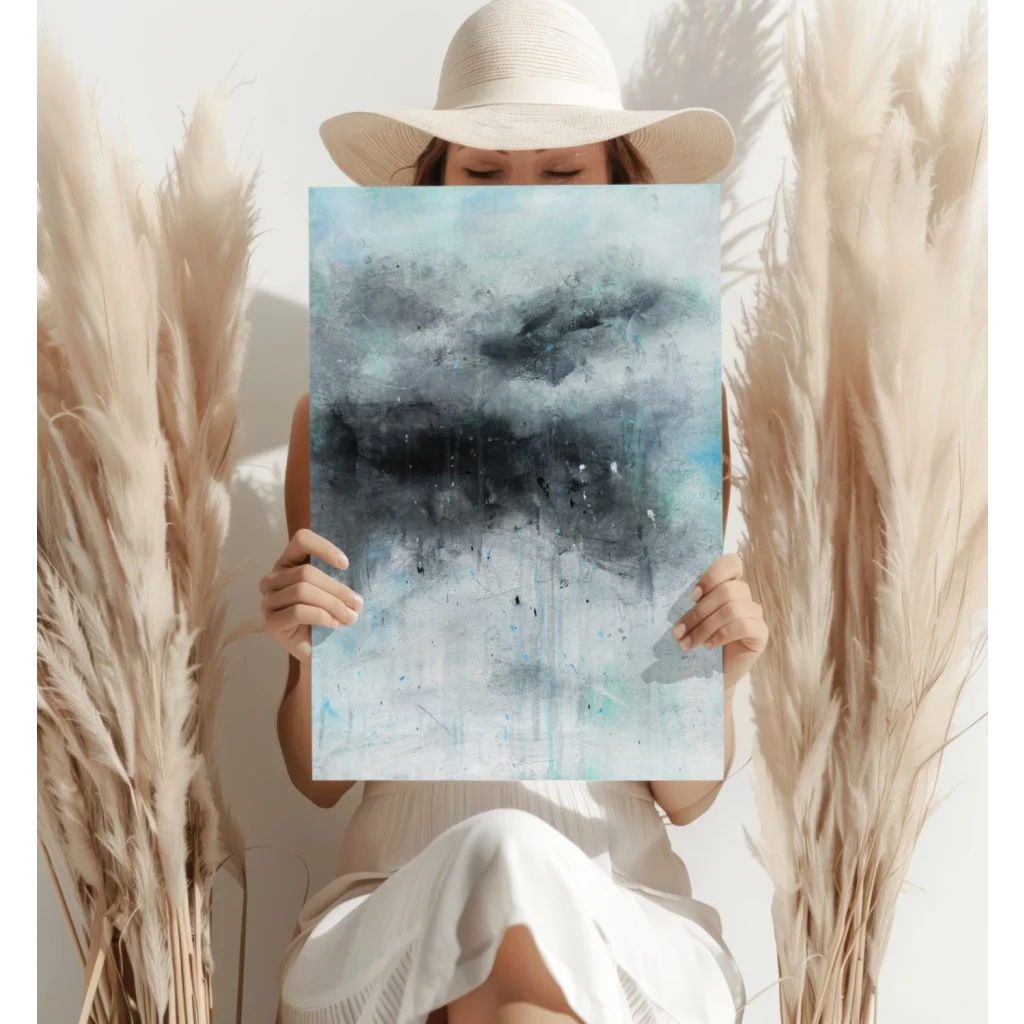 White wide-brimmed hat with black trim on modern abstract print