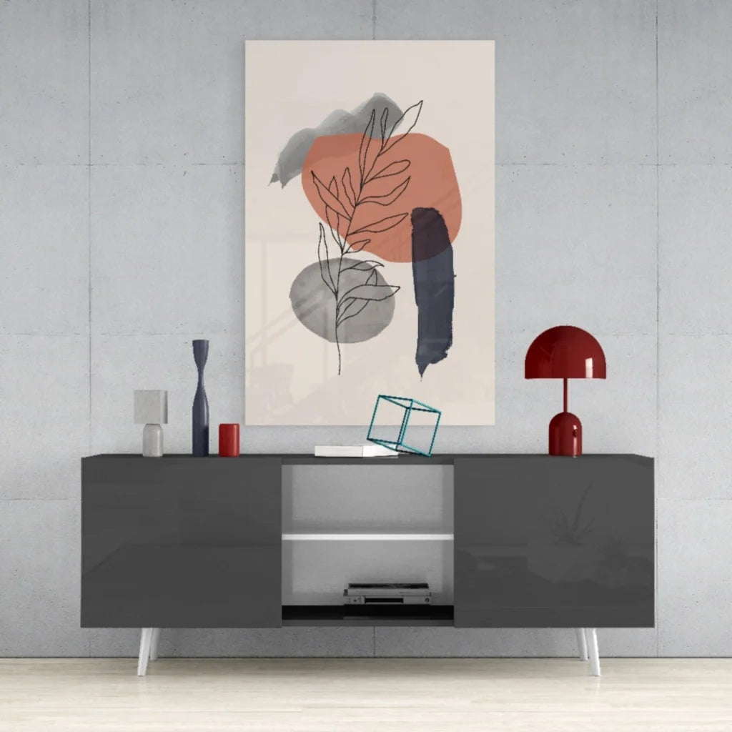 Modern gray sideboard with sleek legs under orange gray black wall art