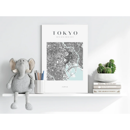 Grey plush elephant toy on Modern Tokyo Map print shelf