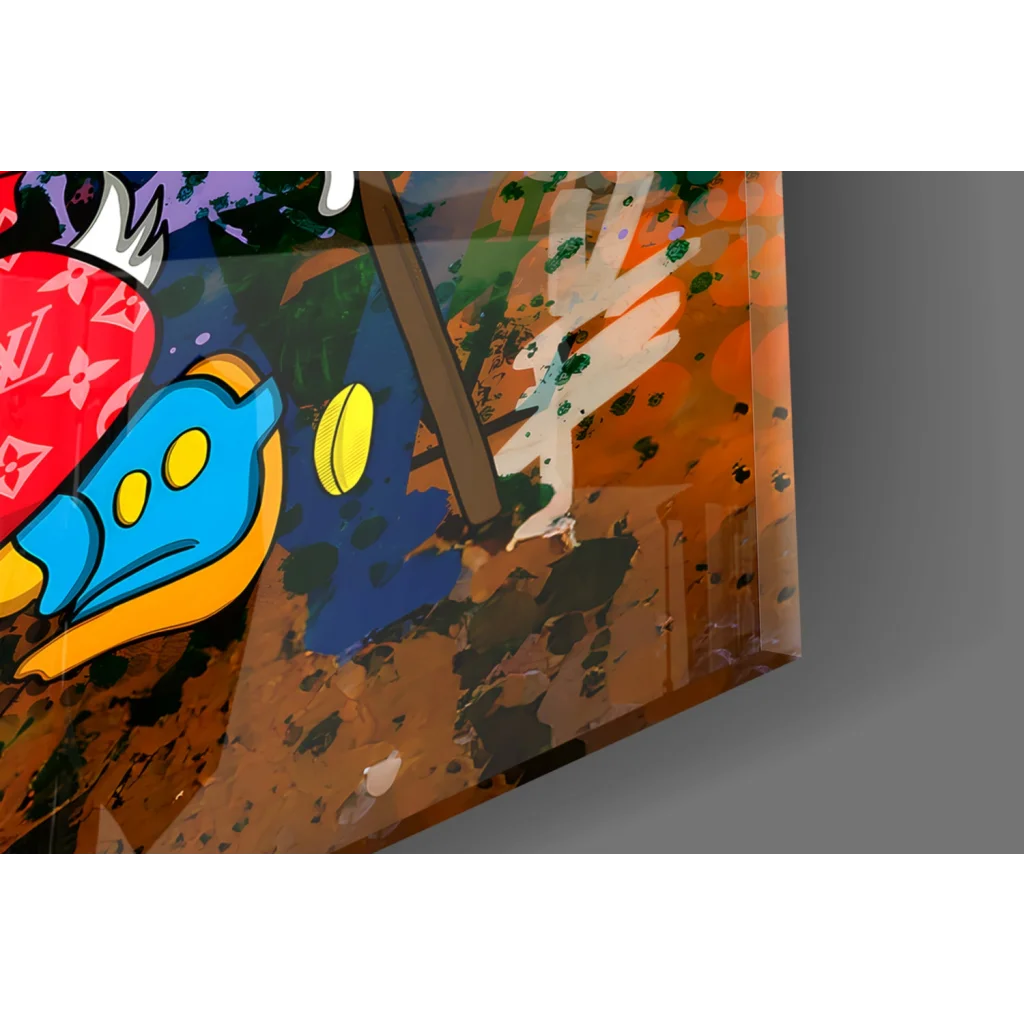 Vibrant glass wall art of cartoonish blue fish with yellow eyes and orange fins on earthy paint backdrop