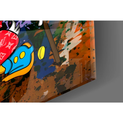 Vibrant glass wall art of cartoonish blue fish with yellow eyes and orange fins on earthy paint backdrop