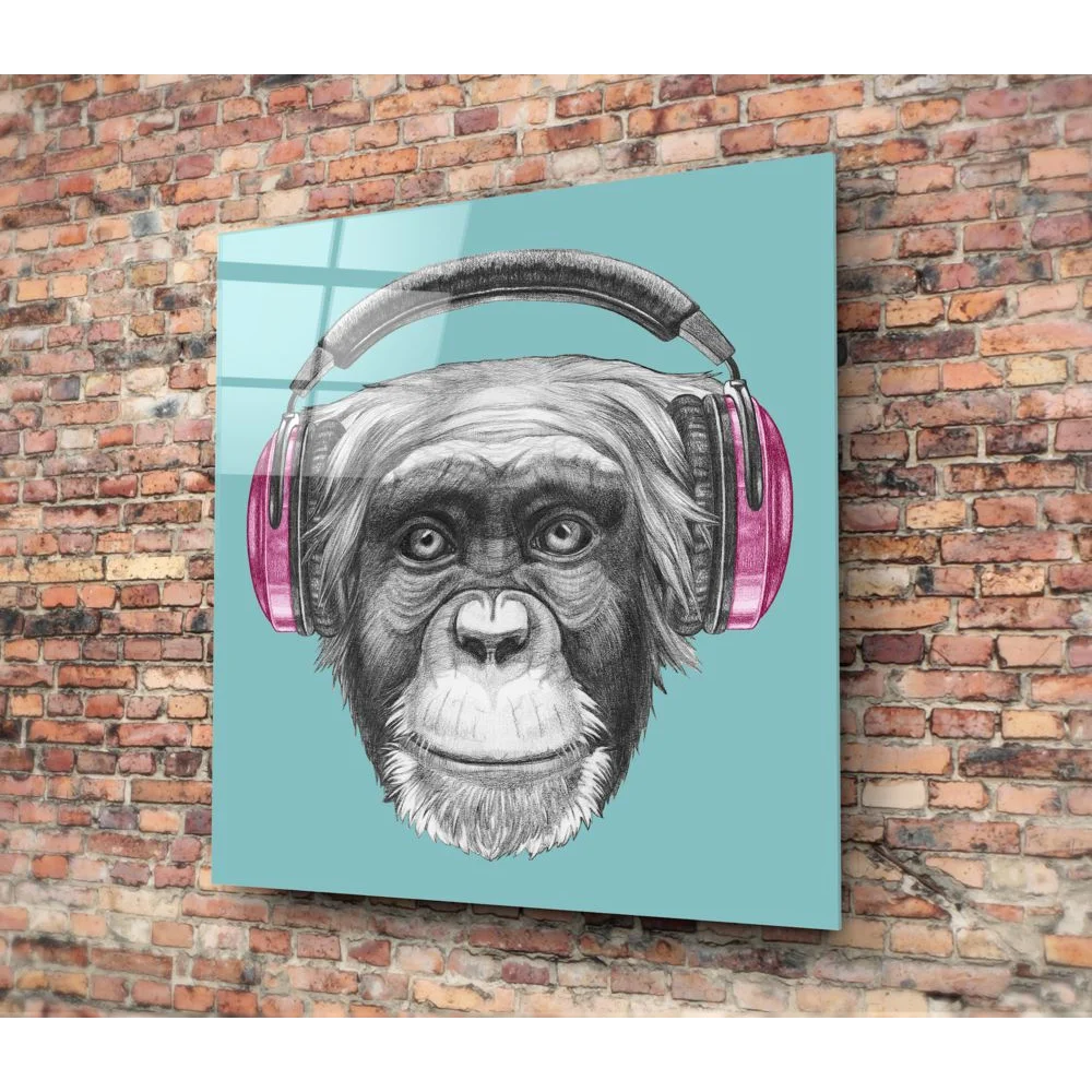 Stylish chimp in pink headphones on tempered glass art panel