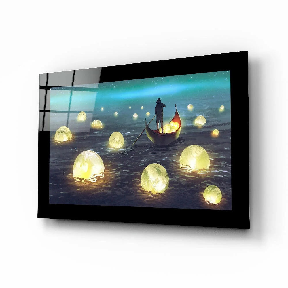 Black-framed glass wall art of glowing lantern silhouette on dark water
