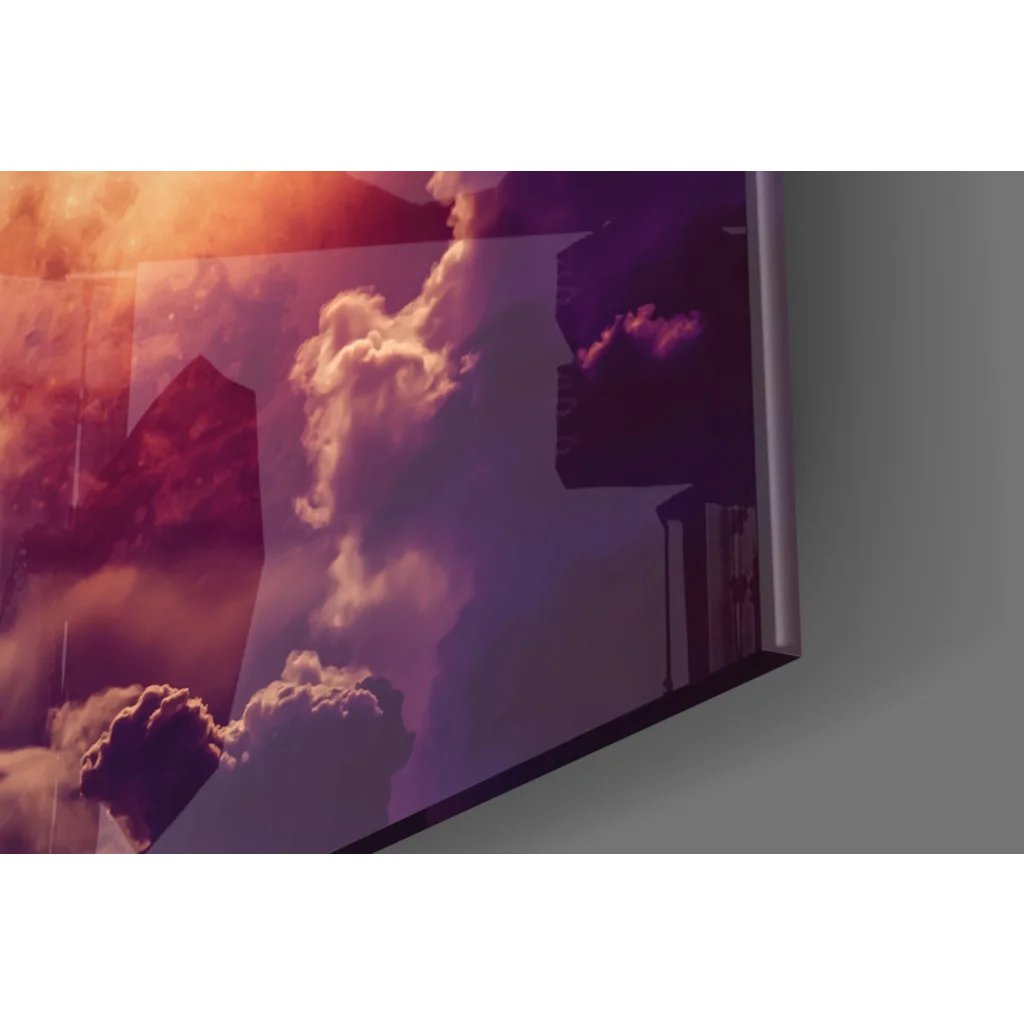 Sleek glass wall art of glowing orange moon in purple night sky with silhouetted buildings