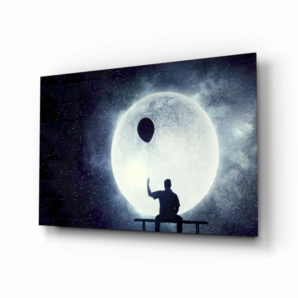 Black silhouette on bench with dark balloon against glowing yin-yang in starry sky wall art