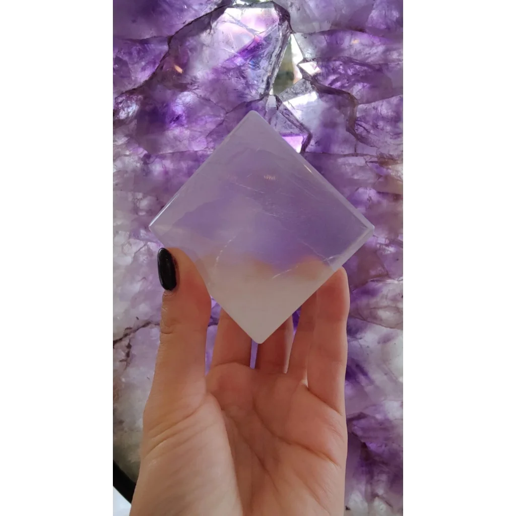 Hand holding translucent Moroccan selenite crystal cube, 470g natural decor