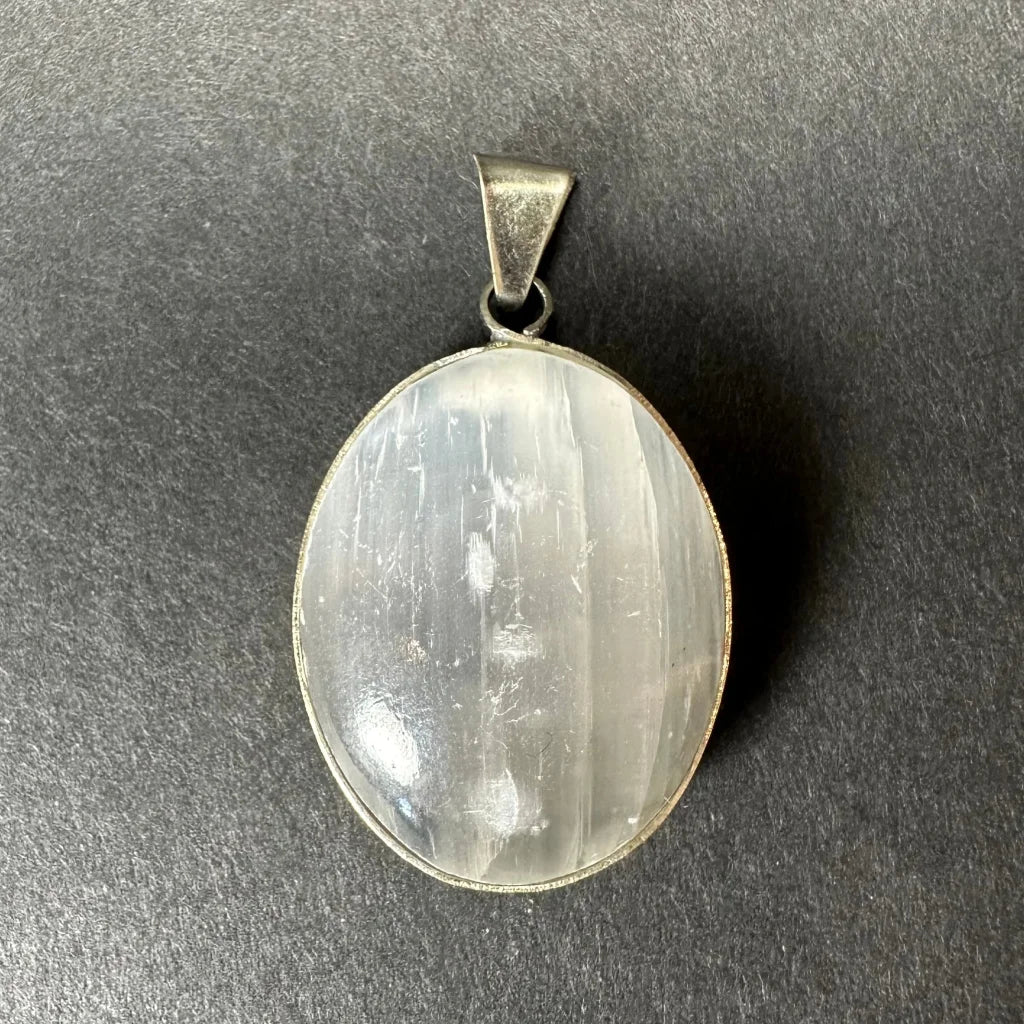 Oval white selenite pendant with sterling silver clasp