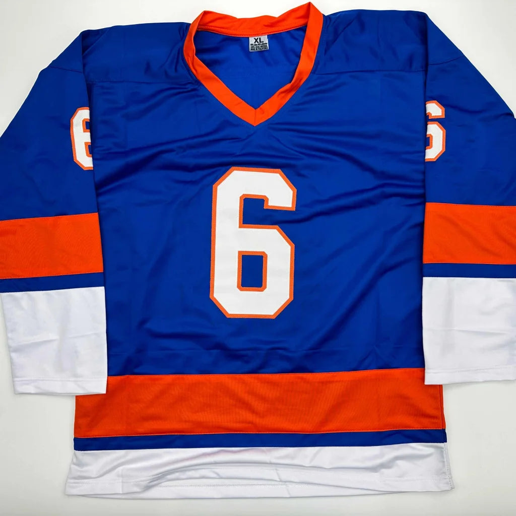 Blue custom hockey jersey with orange and white trim and number 6, autographed pro sports gear