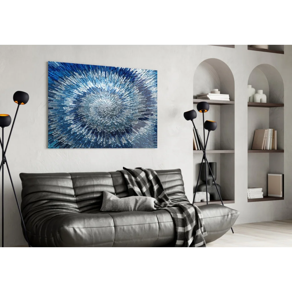Stunning blue radial burst glass wall art with shimmering texture above sofa