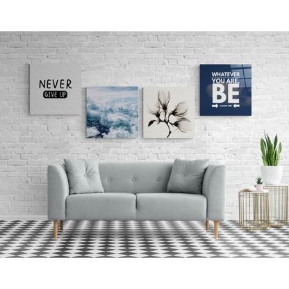 Light gray tufted sofa with wooden legs near stunning glass wall art