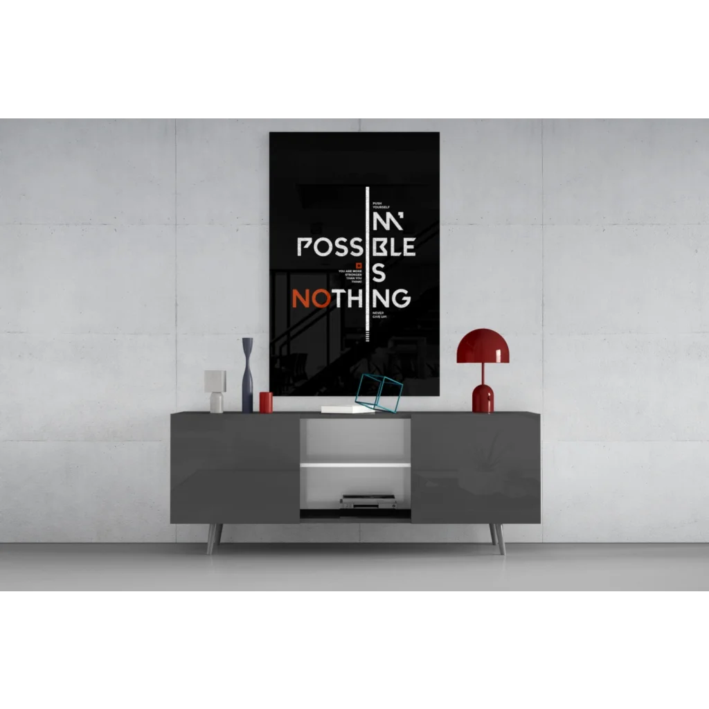 Bold black motivational wall art poster with impossible is nothing typography above gray console