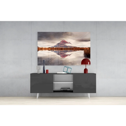 Pink mountain glass wall art with snowy reflection in calm water