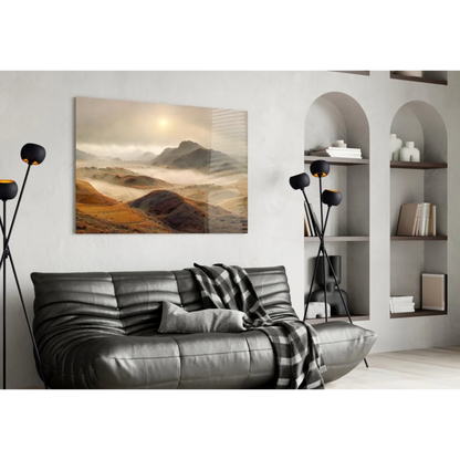 Misty mountain glass wall art in golden earth tones on white wall