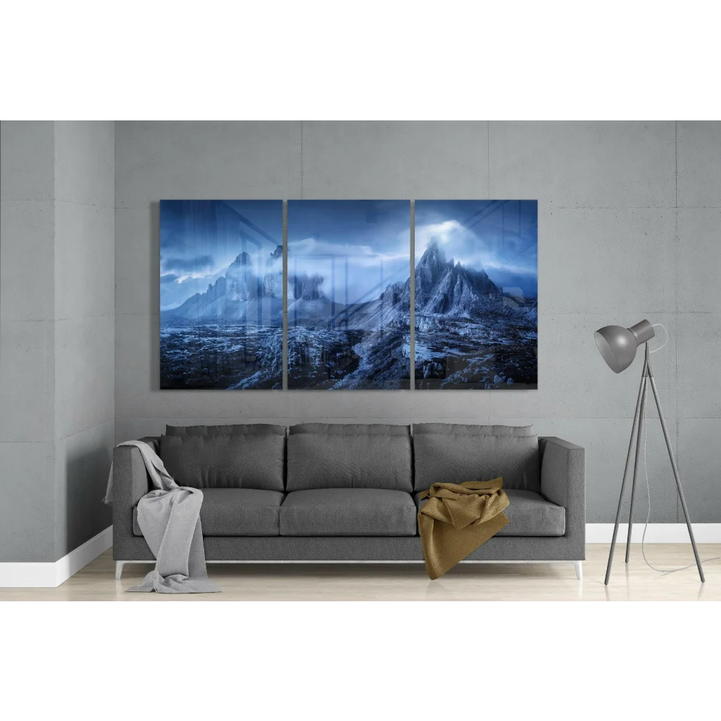 Stunning blue mountain glass wall art triptych above gray sofa