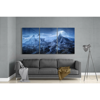 Stunning blue mountain glass wall art triptych above gray sofa