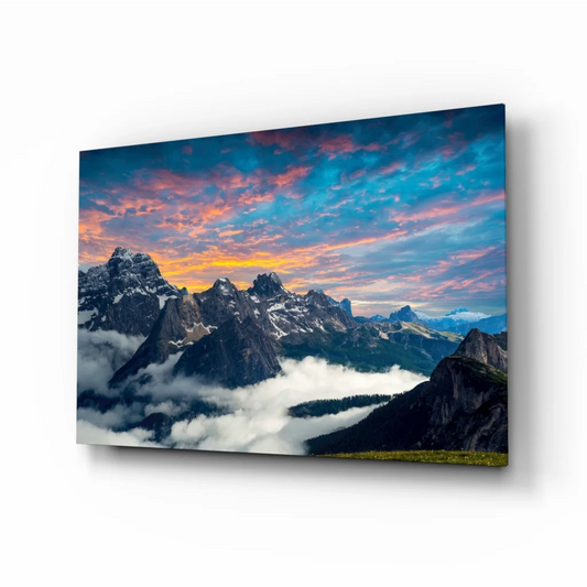 Stunning mountain sunset glass wall art with dramatic sky and peaks