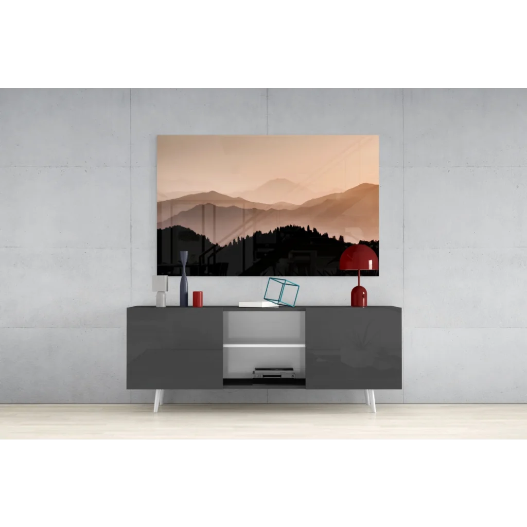 Modern matte black console table with white legs under Sunset Mountain Peaks glass wall art