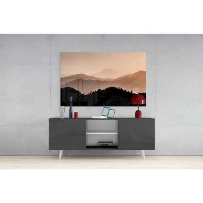 Modern matte black console table with white legs under Sunset Mountain Peaks glass wall art