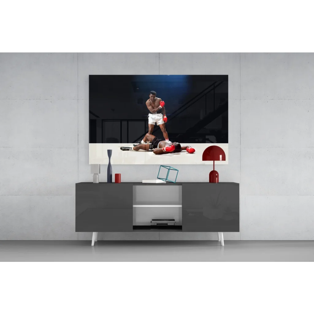 Sleek gray media console under Muhammad Ali knockout wall art