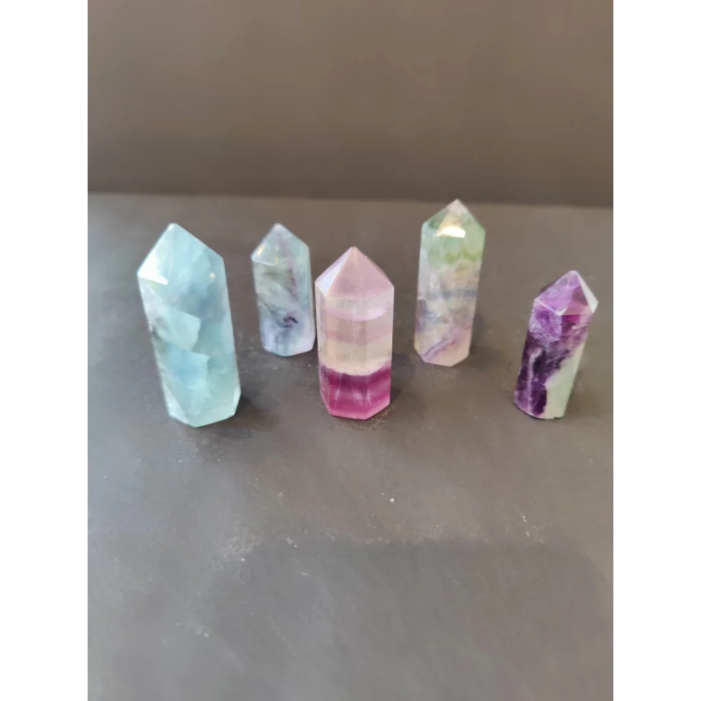 Five multi color fluorite points in blue, purple, pink