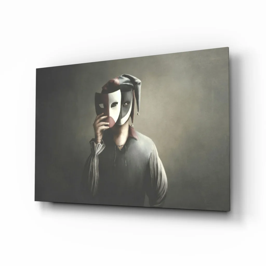 Mysterious masquerade wall art: person in dark attire holds half-white, half-red jester mask