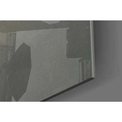 Sleek silver-framed glass wall art mirror with faint studio shadows