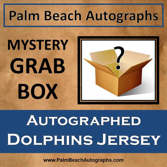 Mystery grab box with tan cardboard, question mark, and Miami Dolphins football jersey